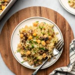 chickpea rice casserole on white plate with fork on marble background