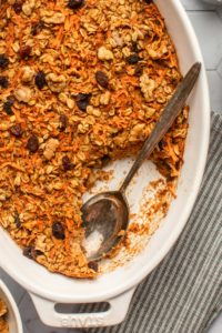 close of photo of baked carrot cake oatmeal on tile background