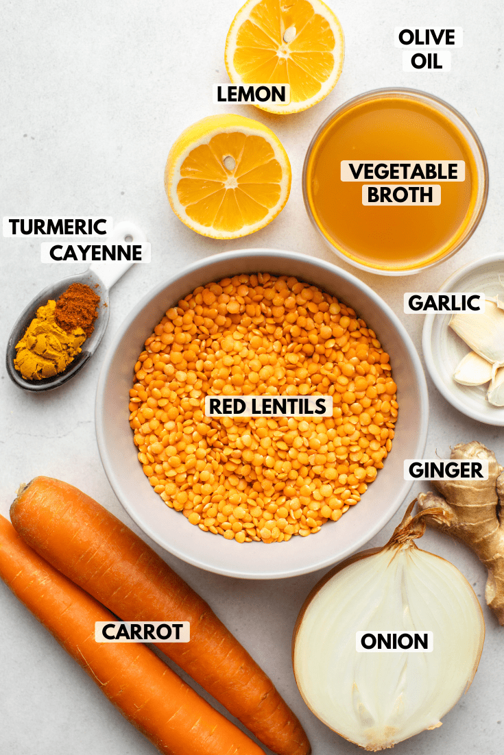 ingredients for lentil soup in small bowls on grey background