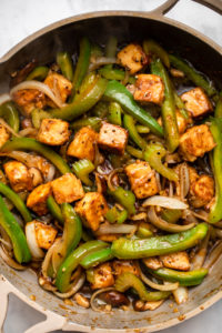 saute pan of black pepper tofu with stir fried vegetables