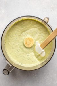 finished creamy white bean dip with herbs in food processor