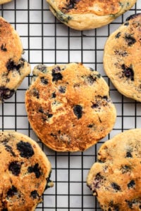 blueberry pancakes on black cooling rack