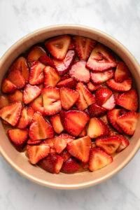 strawberry layer before baking in base of cake pan