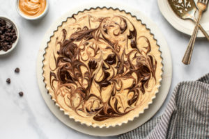 no-bake peanut butter cup pie on marble serving tray on marble background