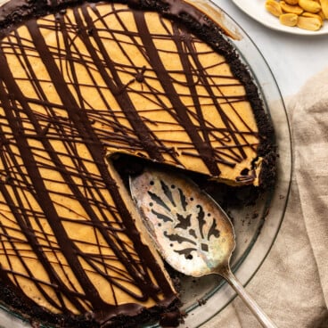 vegan peanut butter cup pie with slice cut out of it