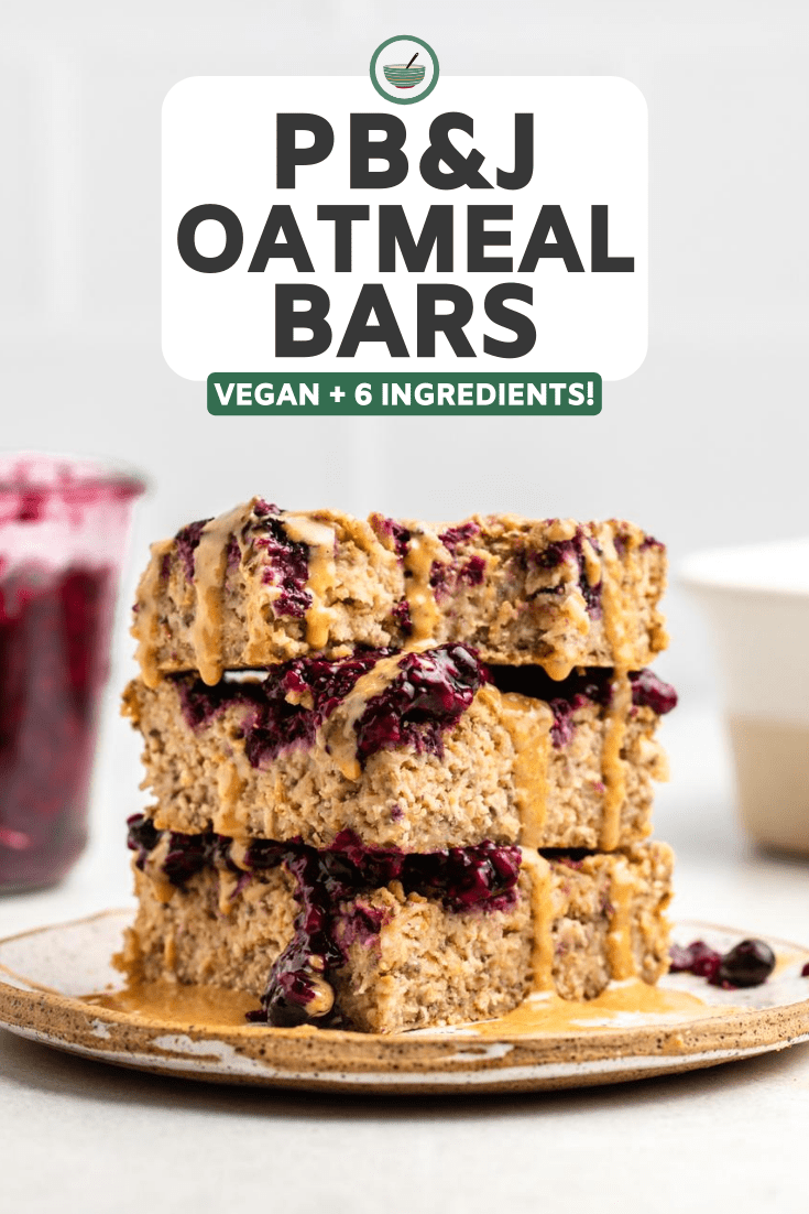 stack of oatmeal bars topped with jam and peanut butter