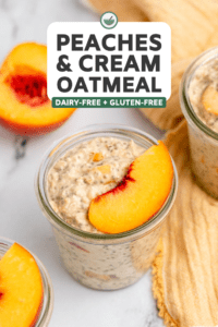 jar of peaches and cream oatmeal topped with peach slice next to peach cut in half