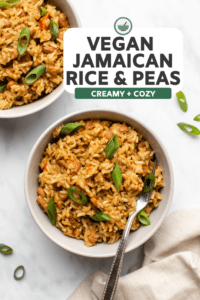 bowl of jamaican rice and peas topped with green onions on marble background
