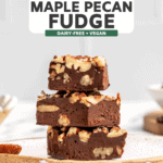 stack of maple pecan fudge on white speckled plate on marble countertop