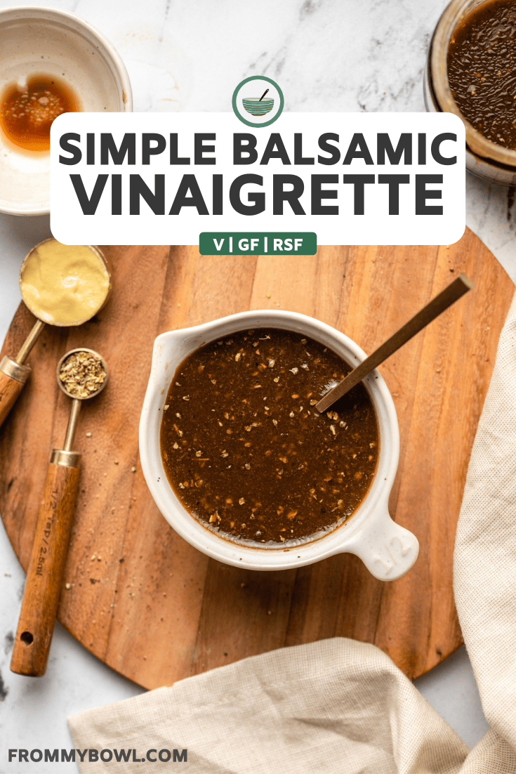 balsamic vinaigrette in white serving bowl on wood cutting board