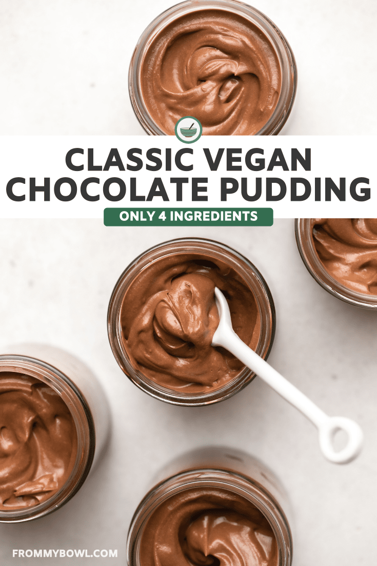 5 small glass jars filled with chocolate pudding that have been swirled on top on stone background