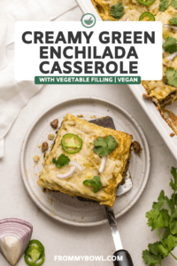 Slice of creamy green enchilada casserole topped with melted vegan cheese, jalapeno,and cilantro.