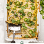 Creamy green casserole topped with melted vegan cheese, jalapenos, cilantro, and red onion.