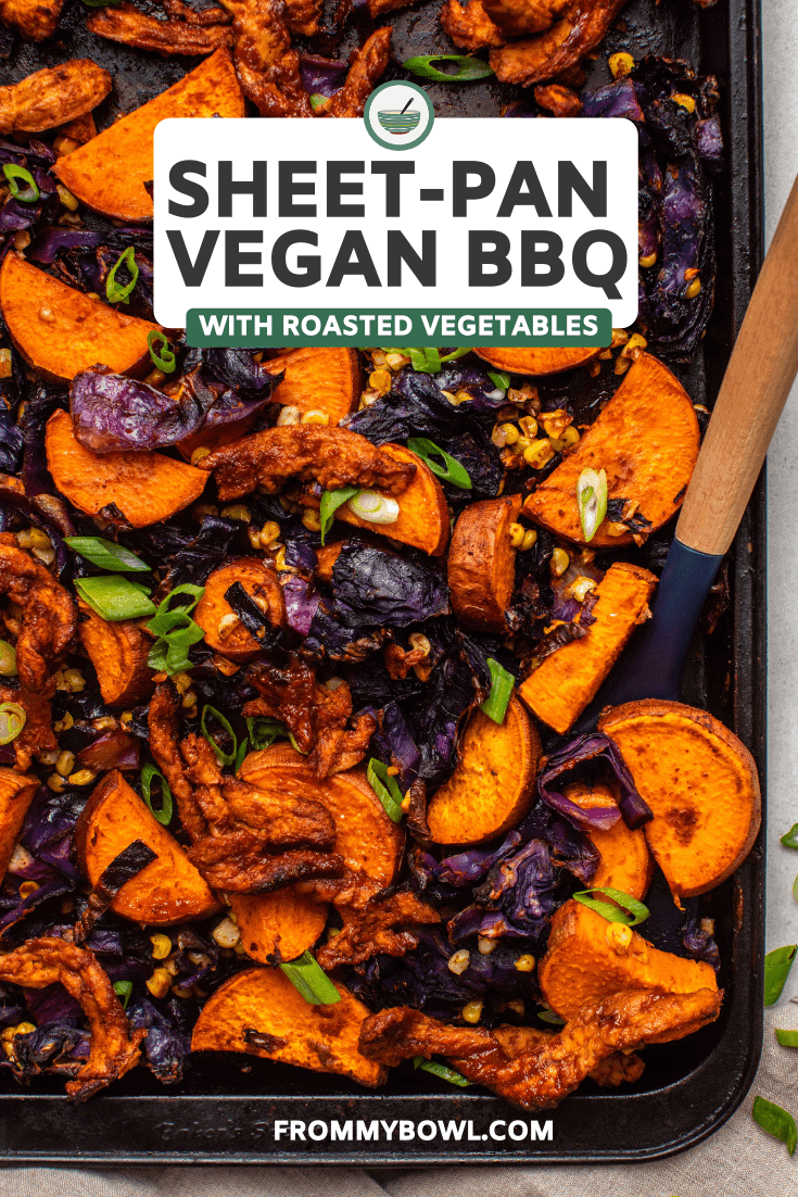 Roasted sweet potato, red cabbage, and corn tossed with bbq soy curls on dark baking tray
