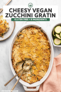 Baked zucchini gratin in white casserole dish with crispy cornmeal topping