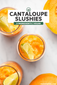 Overhead photo of 3 glasses of cantaloupe slushie with lime wedges and some fresh cantaloupe on the slide