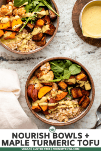 Two side-by-side nourish bowls topped with curry tahini dressing on stone background