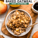 Apple Cinnamon Baked Oatmeal in small white bowl with apples and cinnamon sticks off to the side