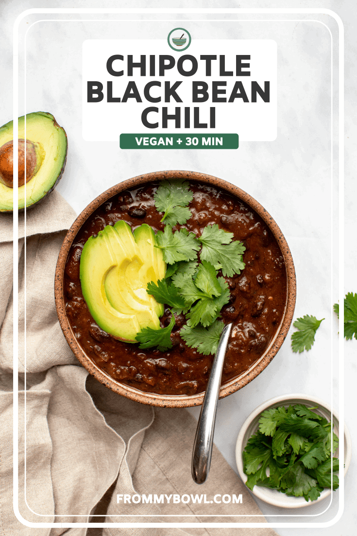 bowl of chipotle black bean chili topped with avocado and cilantro