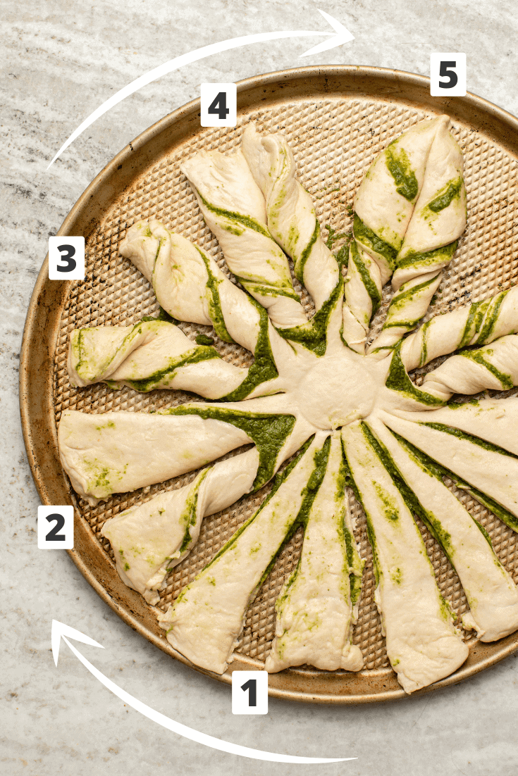 Step-by-step process of twisting dough strips to form a star point