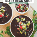 two bowls of black bean soup topped with avocado salsa