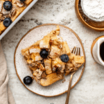 slice of french toast casserole on plate with fork