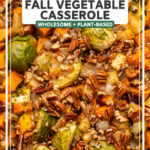 Close-up photo of cooked brussels sprouts and butternut squash topped with pecans