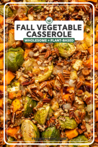 Close-up photo of cooked brussels sprouts and butternut squash topped with pecans