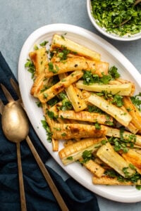 Roasted parsnips on plate topped with gremolata