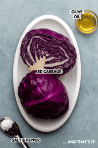Ingredients for red cabbage on countertop. Clockwise text labels read olive oil, red cabbage, and salt & pepper