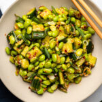 edamame salad in bowl topped with sesame seeds