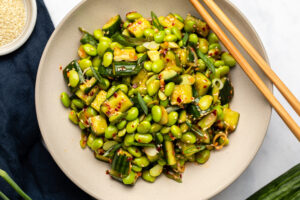edamame salad in bowl topped with sesame seeds