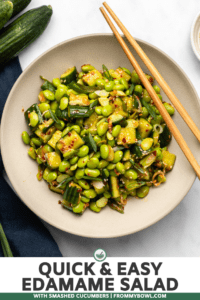 edamame salad in tan bowl topped with sesame seeds