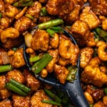 Vegan cashew chicken with cashews and green onions in sauce