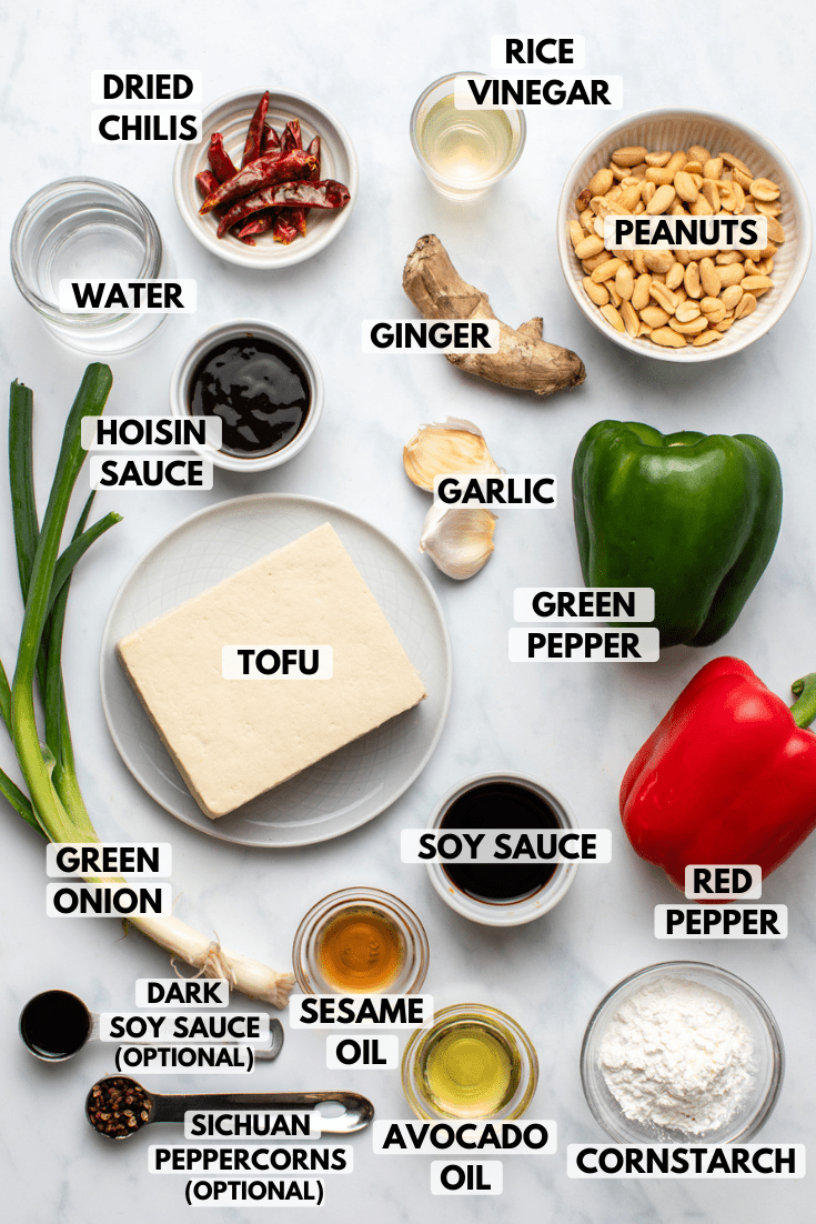 ingredients for kung pao tofu arranged on marble countertop