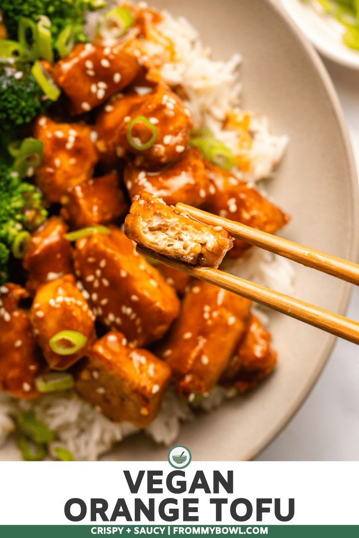 Orange tofu in bowl with white rice and broccoli
