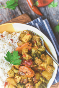 vegan yellow curry in white bowl