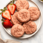 Strawberry sugar cookies on white plate