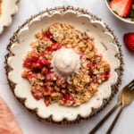 Strawberry rhubarb crisp topped with vanilla ice cream