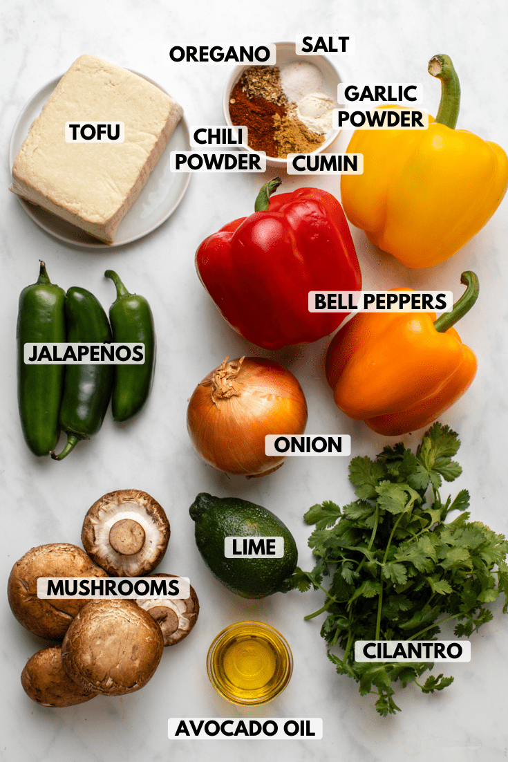 ingredients for vegan fajitas arranged on marble countertop