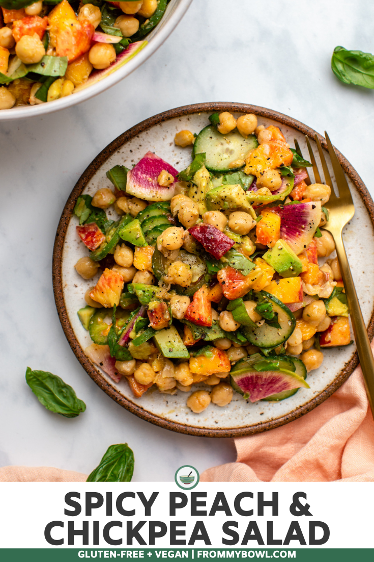 Peach and chickpea salad on plate with golden fork