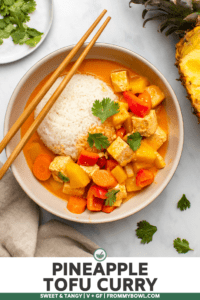 tofu pineapple curry in bowl with white rice and chopsticks