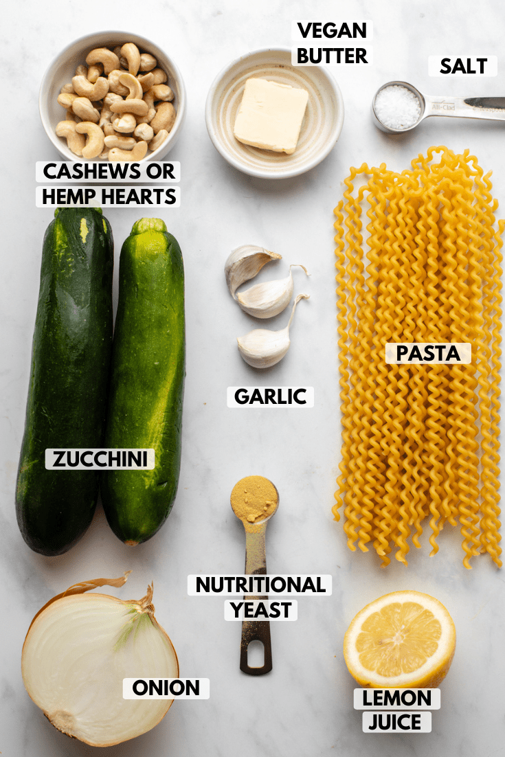 ingredients for zucchini alfredo arranged on kitchen countertop