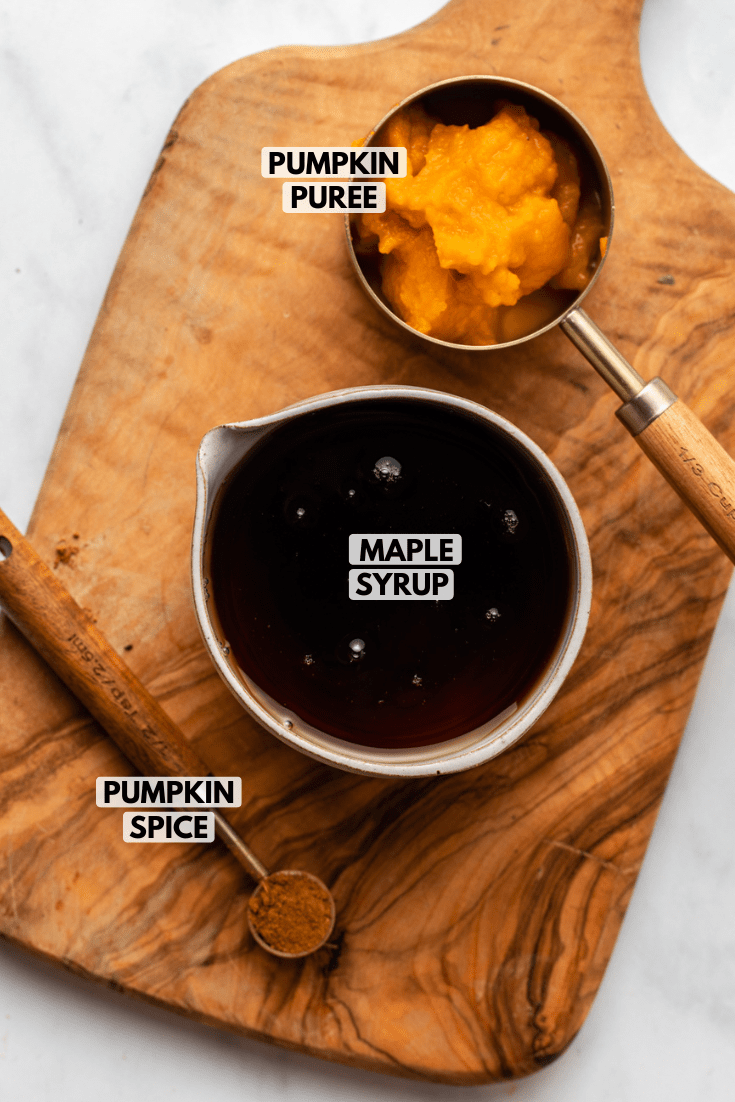 ingredients for pumpkin spice maple syrup on cutting board