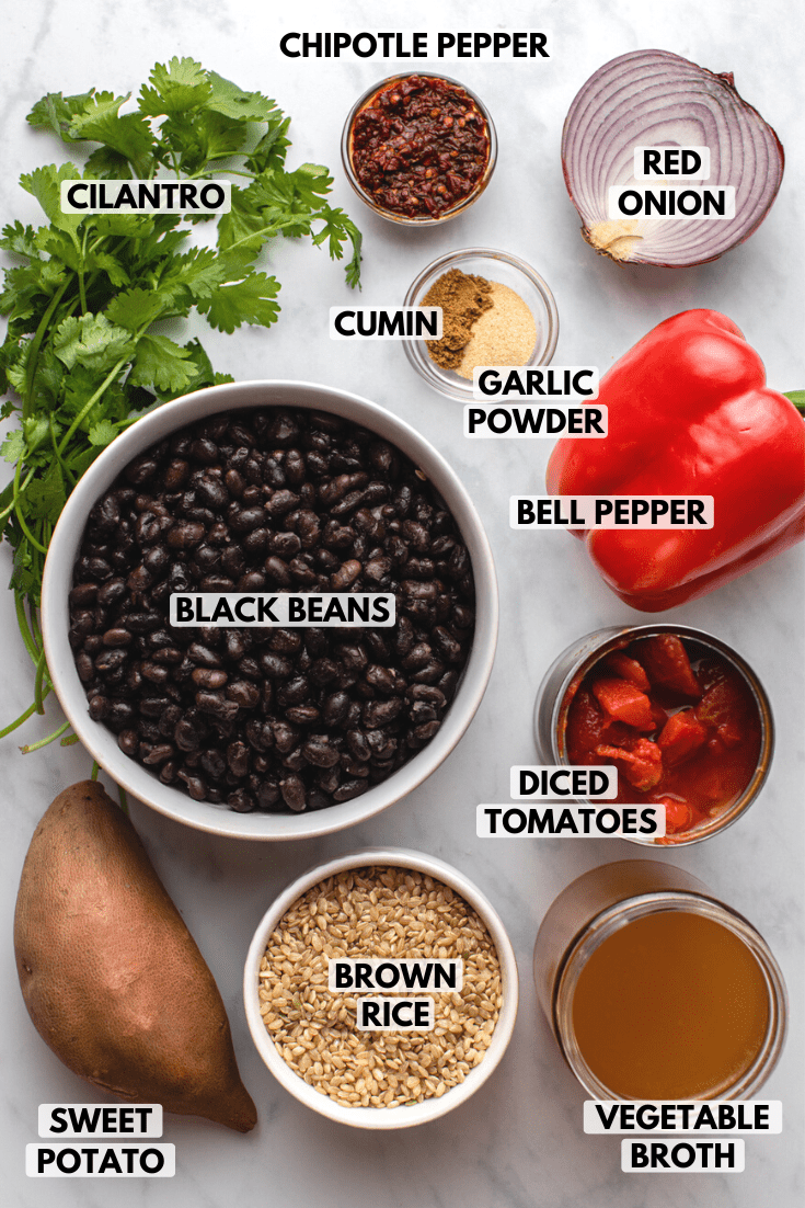 ingredients for the chipotle black bean casserole laid out on a stovetop next to each other
