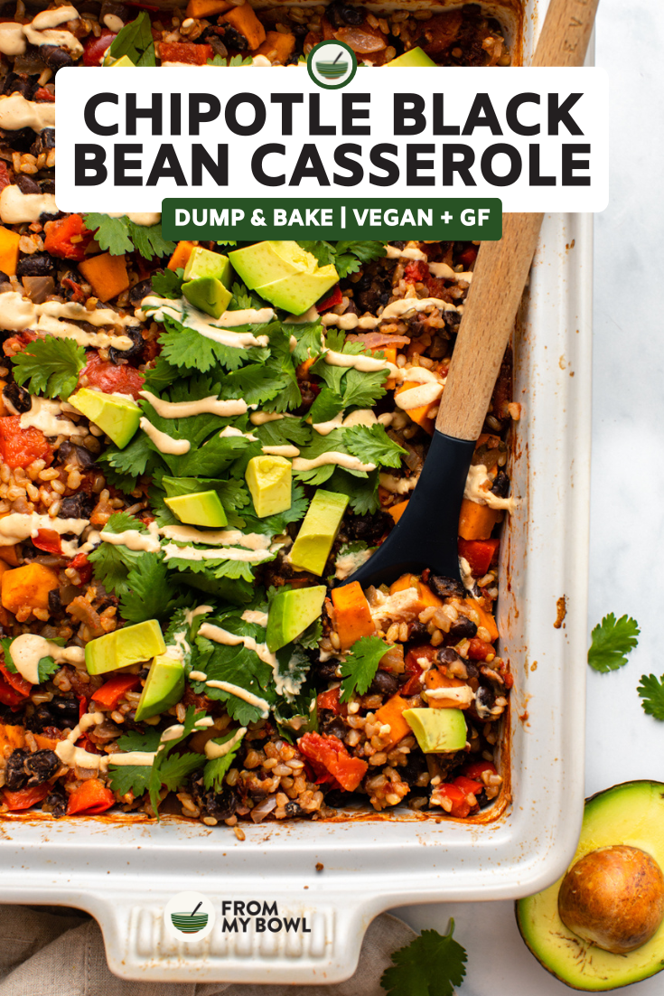 a spoon scooping chipotle black bean dump and bake casserole, topped with cilantro and diced avocado