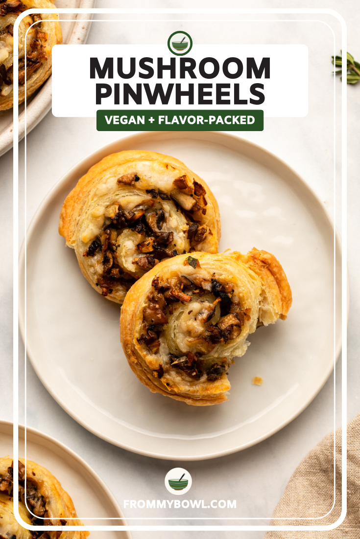 two puff pastry pinwheels on small white plate