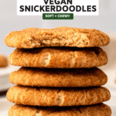 a stack of vegan snickerdoodles with a single bite taken off the one on the top