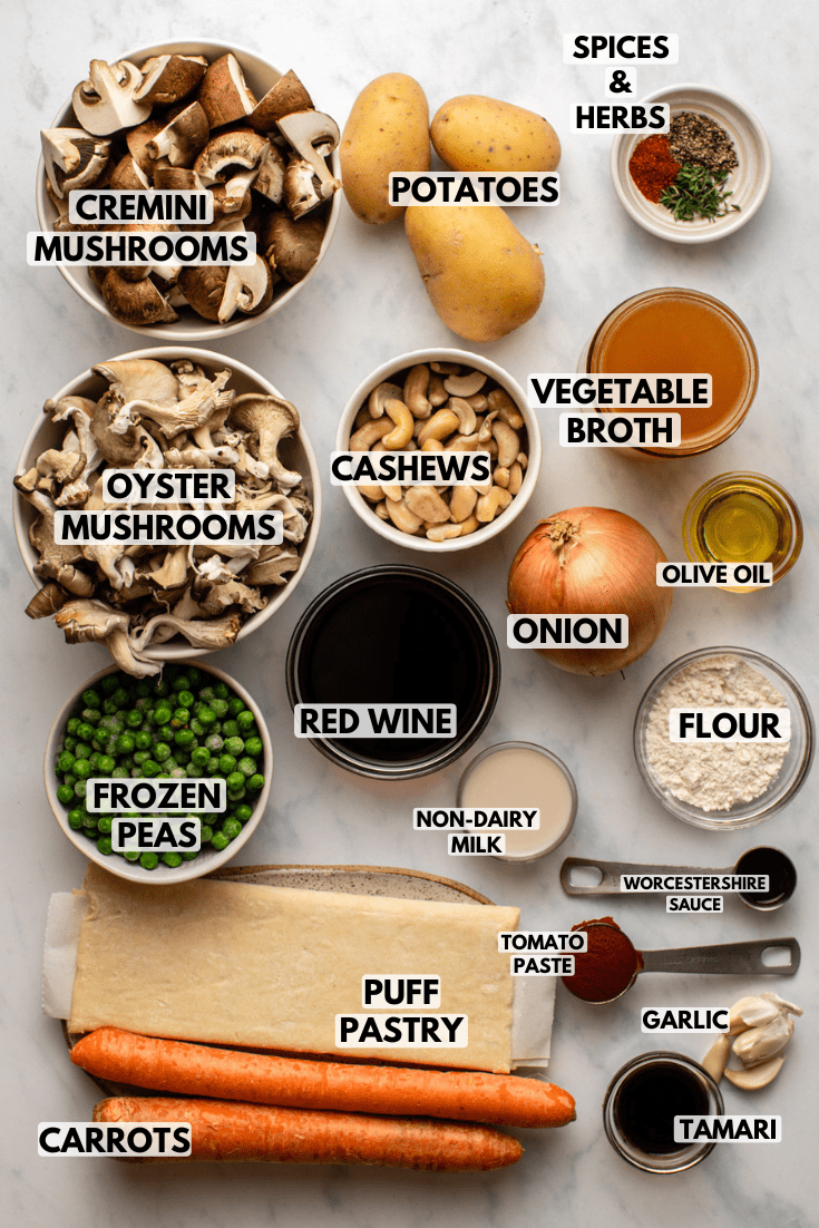 Ingredients for mushroom pot pie in small white bowls on kitchen countertop.