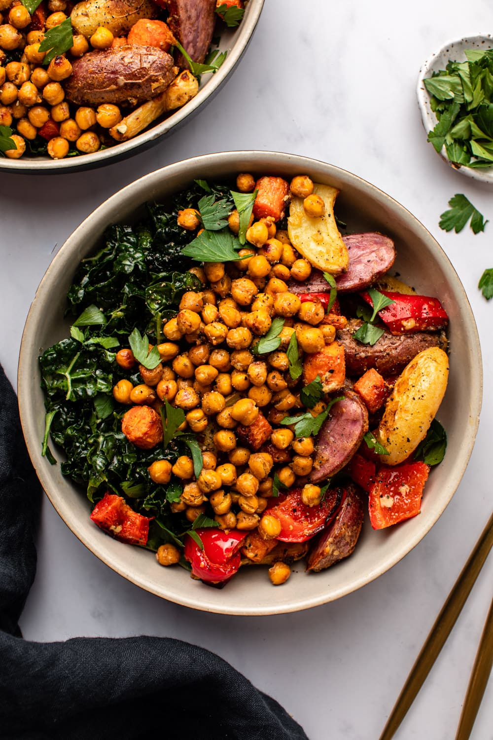 veggies, chickpeas and salad served in a white bowl